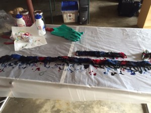 Here's the dye set up. I used discarded water bottles to squeeze red onto some areas and blue onto others.